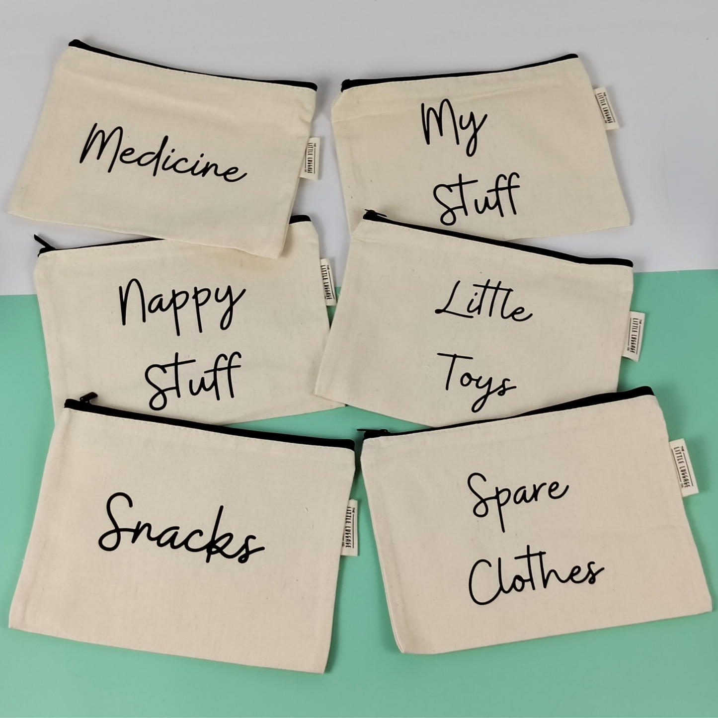 picture of six canvas zipped pouches for baby items